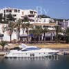 GW29560-60 = Looking North over moored Azimut 62S Luxury Motor Yacht and offices / restaurant area in Cala D'Or Marina, Cala D'Or, Santanyi, South East Mallorca, Balearic Islands, Spain. 7th July 2007.